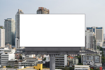 Blank white road billboard with Bangkok cityscape background at day time. Street advertising poster, mock up, 3D rendering. Front view. The concept of marketing communication to promote or sell idea.