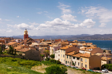 Fototapeta na wymiar Saint-Tropez with old bell tower and residential buildings