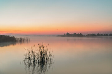 Fototapeta na wymiar Beautiful sunrise on the lake. Polish sunrise