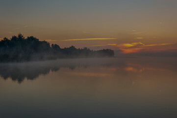 Naklejka na ściany i meble Beautiful sunrise on the lake. Polish sunrise