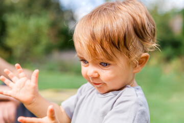 Close-up of baby girl clapping hands