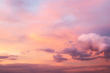 Naklejka na ściany i meble Beautiful sunset sky with clouds. Close-up.