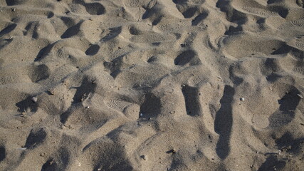 closeup of sand pattern of a beach in the summer