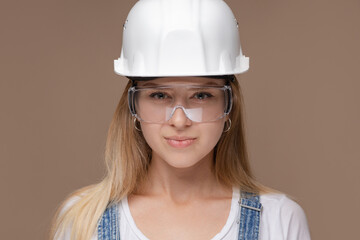 Portrait of attractive architect woman with hard hat, isolated on white background.