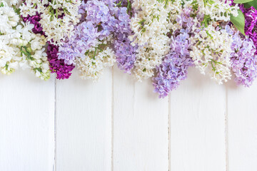 Lilac flowers branch on grey background with copyspace