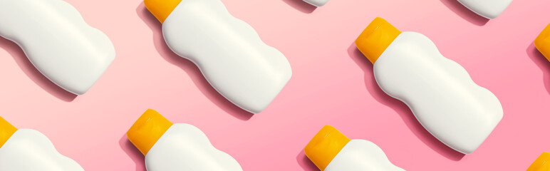 Yellow and white sunblock bottles - flat lay