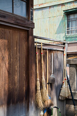Straw Brooms on Fence at Shitaya Jinja Shinto Shrine - obrazy, fototapety, plakaty