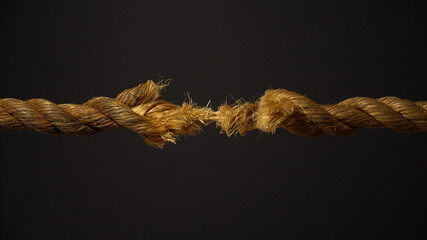 A frayed rope about to snap under stress - obrazy, fototapety, plakaty