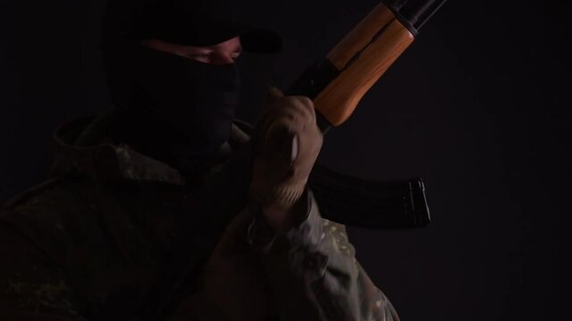 Soldier reloads his gun