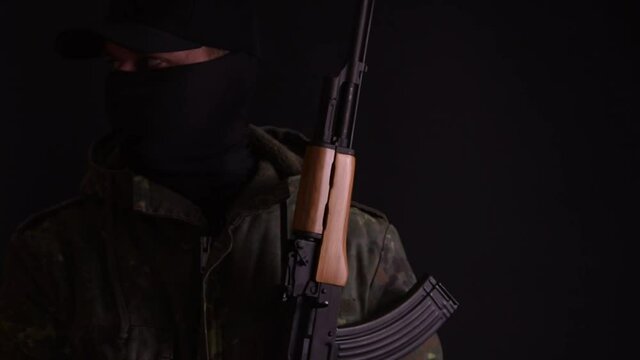 Soldier scanning his surroundings with his gun up