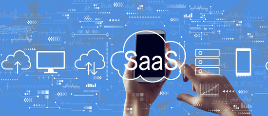SaaS - software as a service concept with person holding a white smartphone