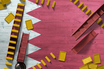 Bahrain flag with national background with dominoes on wooden table. Top view. Concept of game.