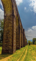 Fototapeta na wymiar A panorama view of the impressive Nottolini aqueduct in Lucca Italy in summer