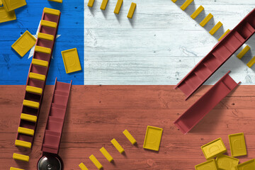 Chile flag with national background with dominoes on wooden table. Top view. Concept of game.