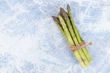 Top view of Fresh Asparagus on the wooden background