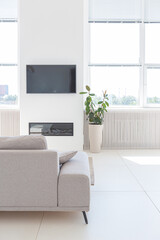 Cozy luxury modern interior design of a studio apartment in extra white colors with fashionable expensive furniture in a minimalist style. white tiled floor, kitchen, relaxation area and workplace