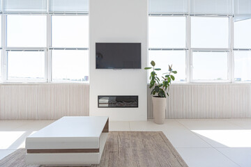 Cozy luxury modern interior design of a studio apartment in extra white colors with fashionable expensive furniture in a minimalist style. white tiled floor, kitchen, relaxation area and workplace