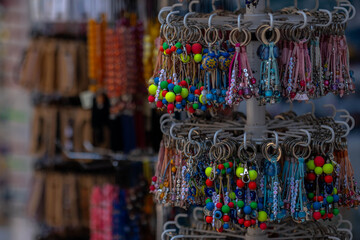 Many various colorful keychains. Keychain collection, Souvenir key rings with the symbols in the gift shop. Ioannina Epirus Greece