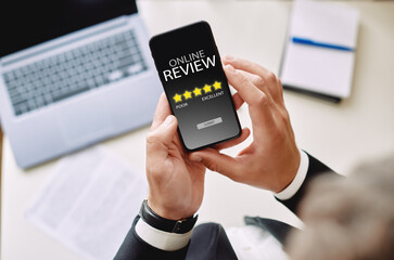 Online review rating concept. man using a smartphone puts an online rating