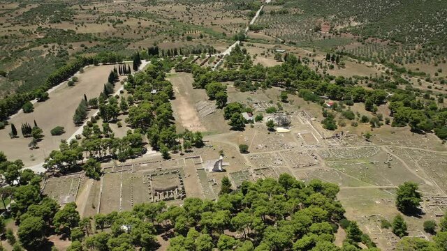 Aerial drone video of archaeological site and stadium of ancient Epidaurus or Epidavros, Argolida, Peloponnese, Greece