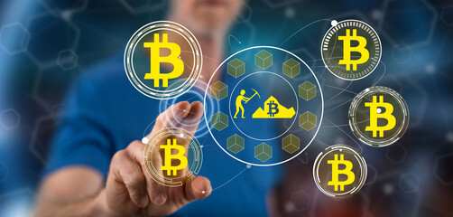 Man touching a bitcoin mining concept