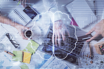 Double exposure of man's hands typing over computer keyboard and brain hologram drawing. Top view. Ai and data technology concept.