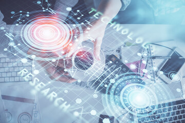 Double exposure of man and woman working together and data theme hologram drawing. Computer background. Top View.