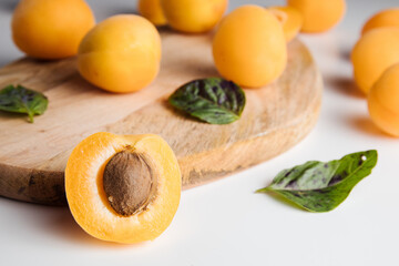 Close-up of ripe peaches on the table. Ripe peaches with leaves