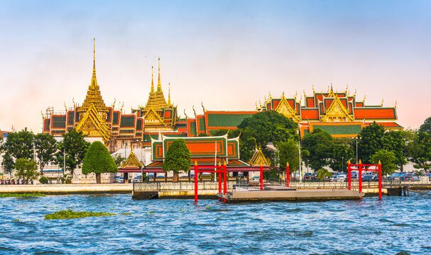 Grand Palace and Temple of Emerald Buddha (Wat Phra Kaew) in Bangkok, Thailand as Seen from the Boat on Chao Phraya River