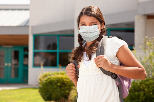 Hispanic Student Girl Wearing Face Mask with Backpack on School Campus