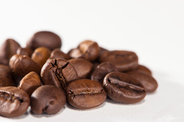 
black coffee beans on a white background close-up