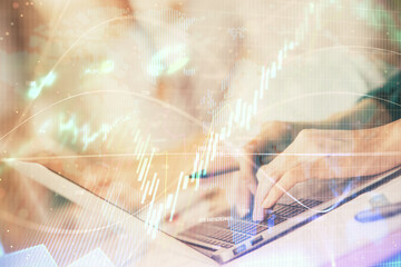 Double exposure of woman hands typing on computer and forex chart hologram drawing. Stock market invest concept.