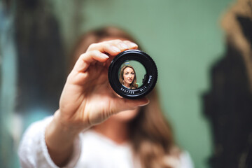 portrait of woman looking searching through lense