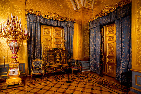 SAINT PETERSBURG, RUSSIA - FEB 24, 2015: Golden room in the State Hermitage, a museum of art and culture in Saint Petersburg, Russia. It was founded in 1764 by Catherine the Great