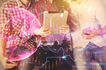 Double exposure of forex graph drawing and man and woman working together holding and using a mobile device. Trade concept.