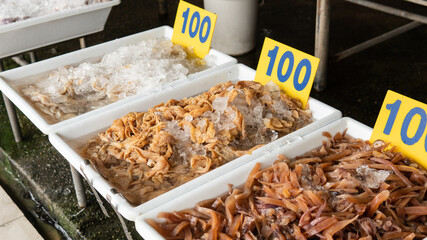 selling seafood in Asian markets. Sea crabs and a variety of fish for sale