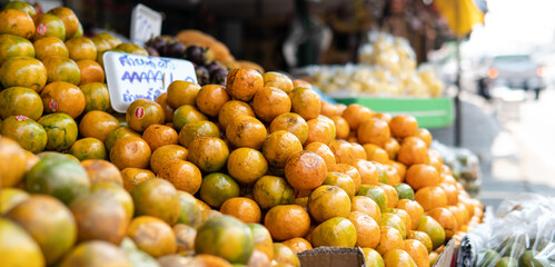 .selling Asian oranges in the fruit markets.