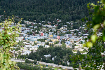 Colorful Dawson City in the Klondike, gold rush town taken in the summer when the trees are green...