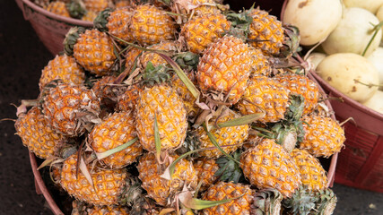 .selling pineapple fruits in tropical markets in Asia. World imports of pineapples and exotic fruits