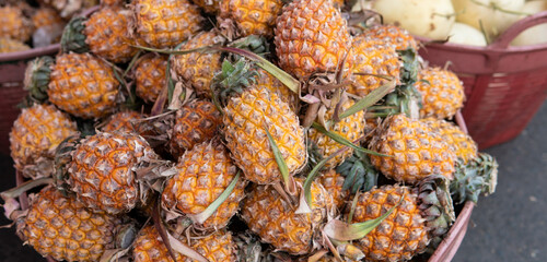 .selling pineapple fruits in tropical markets in Asia. World imports of pineapples and exotic fruits