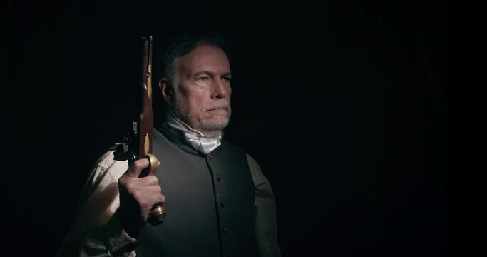 A dramatically lit scene of a mature gentleman of the American Revolutionary era who hears something and raises his flintlock pistol in anticipation of trouble.
