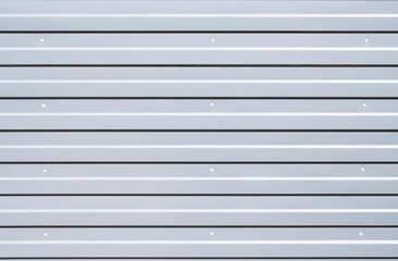 Obraz premium Sheet metal with little texture grey color. Sheet material for metalwork walls. Silver iron wall. Corrugated iron. Galvanized iron wall plate background. Sheet wall panel close up.