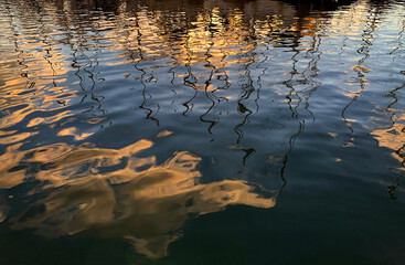 Reflection of yachts in the water