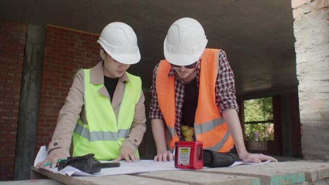 The engineer and worker control and check and coordinate the construction process