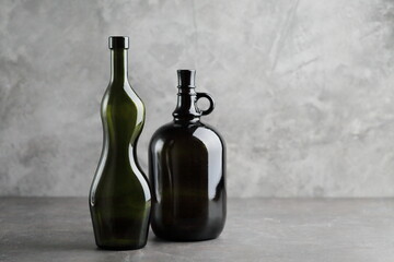 Fototapeta na wymiar Wine bottle on a concrete background. Free space for inscription Fitness concept