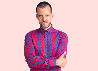 Young handsome man wearing casual clothes skeptic and nervous, disapproving expression on face with...