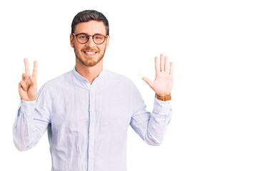 Fototapeta premium Handsome young man with bear wearing elegant business shirt and glasses showing and pointing up with fingers number seven while smiling confident and happy.