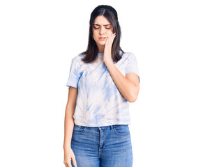 Young beautiful girl wearing casual t shirt touching mouth with hand with painful expression because of toothache or dental illness on teeth. dentist