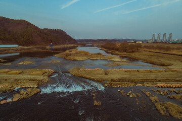 Small river flowing through countryside