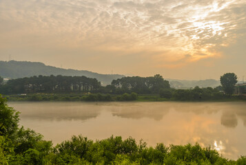 River under early morning cloud cover